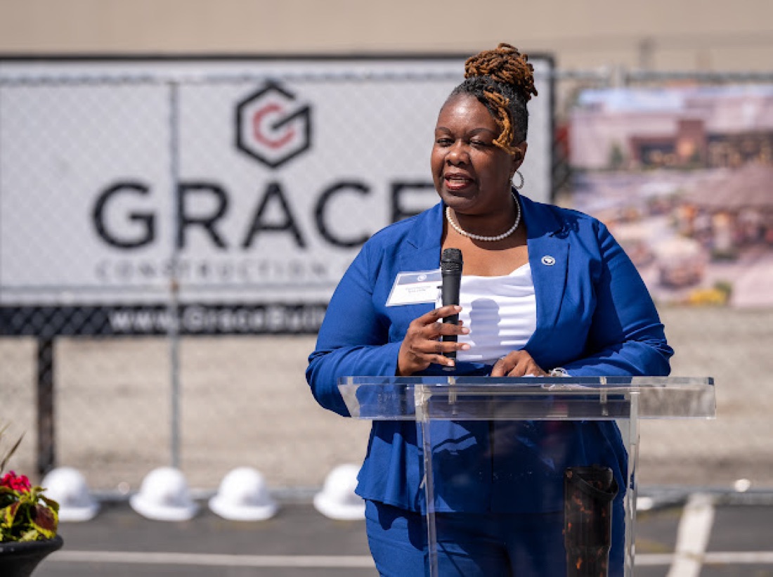 Tyra Little speaking at a groundbreaking ceremony